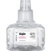 Clear Gojo hand soap dispenser.